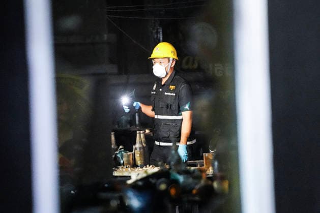 Bangkok Pub Fire Kills At Least 27 People Forensic police officers inspect the site of a deadly fire at a pub in Bangkok, Thailand, on July 13, 2026. A large fire engulfs the pub early on Monday morning local time, resulting in the deaths of at least 27 people before firefighters bring the blaze under control, according to officials. Bangkok Bangkok Thailand  Copyright: xAnusakxLaowilasx originalFilename: laowilas-notitle260713_nplSn.jpg