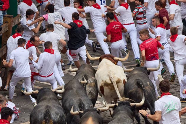 July 13, 2026, Pamplona, Navarre, Spain: People take part in the traditional encierro (bull-run) of the San Fermin Festival in Pamplona, Spain on July 13, 2026. The bull-running fiesta is held annually from 06 to 14 July in commemoration of the city s patron saint. Visitors from all over the world attend the festival. Many of them physically participate in the highlight event - the running of the bulls, or encierro - where they attempt to outrun the animals along a route through the narrow streets of Pamplona s old city. Pamplona Spain - ZUMAa206 20260713_zsp_a206_033 Copyright: xRubenxAlbarranx