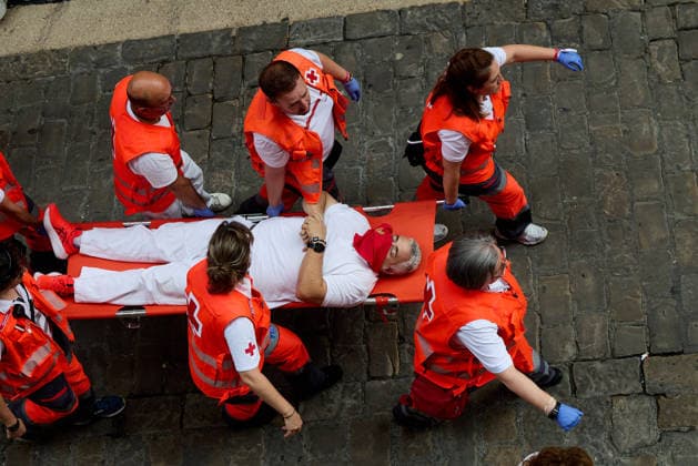July 13, 2026, Pamplona, Navarre, Spain: People take part in the traditional encierro (bull-run) of the San Fermin Festival in Pamplona, Spain on July 13, 2026. The bull-running fiesta is held annually from 06 to 14 July in commemoration of the city s patron saint. Visitors from all over the world attend the festival. Many of them physically participate in the highlight event - the running of the bulls, or encierro - where they attempt to outrun the animals along a route through the narrow streets of Pamplona s old city. Pamplona Spain - ZUMAa206 20260713_zsp_a206_035 Copyright: xRubenxAlbarranx