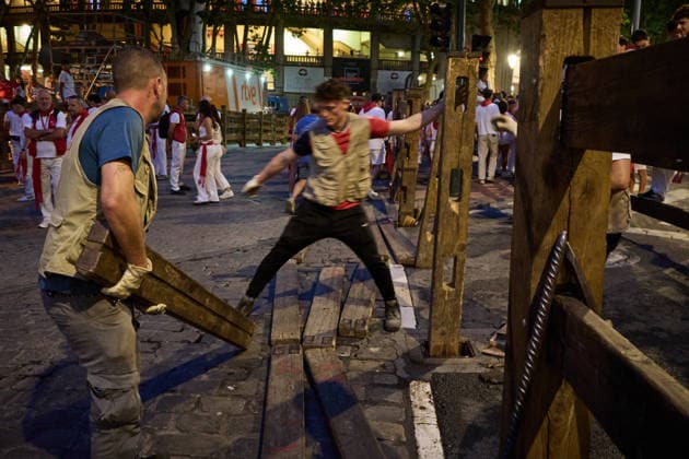 Seventh bull run of the 2026 San Fermín Festival, featuring Miura bulls; carpenters setting up the fencing before the seventh bull run of the 2026 San Fermín Festival, on July 13, 2026, in Pamplona, Navarre, Spain. On this occasion, the seventh running of the San Fermín festival featured bulls from the Miura ranch in Spain.  Copyright: xEduardoxSanzx 7661312