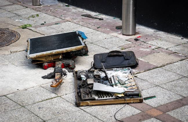 July 13, 2026, Bangkok, Thailand: A view of a burned guitar and other fire-damaged musical equipment left on the sidewalk outside the Rong Beer Na Lat Phrao pub after the fire on Lat Phrao Road in Bangkok. The aftermath of a deadly fire at the Rong Beer Na Lat Phrao pub in Bangkok on 13 July 2026. The blaze killed at least 27 people and injured dozens. Authorities are investigating the cause of the fire. Bangkok Thailand - ZUMAs197 20260713_aaa_s197_013 Copyright: xNathaliexJamoisx