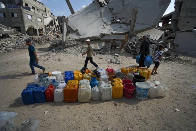 July 13, 2026, Khan Younis, Palestine, State of: KHAN YOUNIS, GAZA STRIP Ã¢â‚¬ JULY 13, 2026: Palestinians wait in line for hours to collect water from a mobile water tanker in central Khan Younis, southern Gaza Strip, on July 13, 2026. With severe shortages of clean water and soaring summer temperatures, residents continue to struggle to secure their daily water supply as the humanitarian crisis deepens. JNA PRESS Khan Younis Palestine, State of - ZUMAq101 20260713_zna_q101_060 Copyright: xRamzixAbuxAmerx