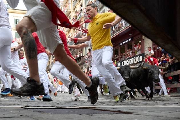 July 13, 2026, Pamplona, Spain: PAMPLONA, SPAIN Ã¢â‚¬ JULY 13, 2026: Bulls from the renowned Miura ranch in Seville charge through the Mercaderes corner during the seventh encierro of the San FermoÂ­n festival in Pamplona, northern Spain, on July 13, 2026. The Miura bull run traditionally concludes the annual festival, drawing thousands of runners and spectators to the historic streets of the Navarrese capital. JNA Press Pamplona Spain - ZUMAq101 20260713_zna_q101_113 Copyright: xUnaixBeroizx