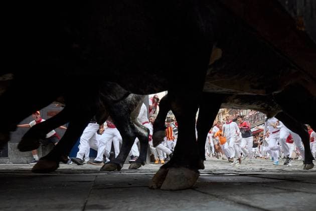 July 13, 2026, Pamplona, Spain: PAMPLONA, SPAIN Ã¢â‚¬ JULY 13, 2026: Bulls from the renowned Miura ranch in Seville charge through the Mercaderes corner during the seventh encierro of the San FermoÂ­n festival in Pamplona, northern Spain, on July 13, 2026. The Miura bull run traditionally concludes the annual festival, drawing thousands of runners and spectators to the historic streets of the Navarrese capital. JNA Press Pamplona Spain - ZUMAq101 20260713_zna_q101_115 Copyright: xUnaixBeroizx
