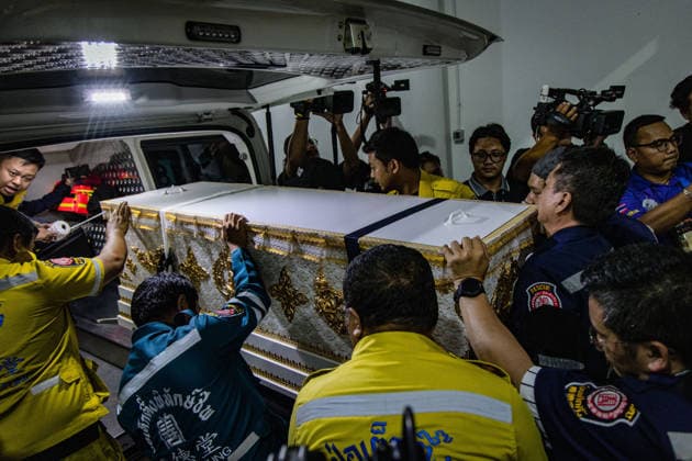 Relatives gather to claim bodies after Bangkok pub fire BANGKOK, THAILAND - JULY 13: Rescue workers and family members bring the coffins as relatives of the victims of a deadly pub fire arrive at the Institute of Forensic Medicine at the Police Hospital to claim the bodies in Bangkok, Thailand on July 13, 2026. The blaze at The Rong Beer Na Lat Phrao pub resulted in at least 27 deaths and left 63 others injured, including 22 in critical condition, making it one of the deadliest incidents in the popular tourist destination. Wissarut Weerasopon Anadolu Bangkok Thailand. Editorial use only. Please get in touch for any other usage.  Copyright: x2026xAnadoluxWissarutxWeerasoponx