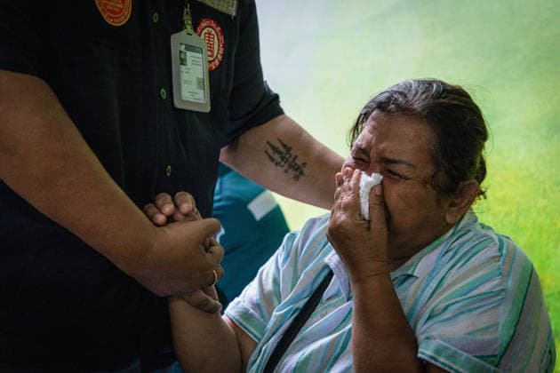 Relatives gather to claim bodies after Bangkok pub fire BANGKOK, THAILAND - JULY 13: Relatives of the victims of a deadly pub fire mourn as they arrive at the Institute of Forensic Medicine at the Police Hospital to claim the bodies in Bangkok, Thailand on July 13, 2026. The blaze at The Rong Beer Na Lat Phrao pub resulted in at least 27 deaths and left 63 others injured, including 22 in critical condition, making it one of the deadliest incidents in the popular tourist destination. Wissarut Weerasopon Anadolu Bangkok Thailand. Editorial use only. Please get in touch for any other usage.  Copyright: x2026xAnadoluxWissarutxWeerasoponx