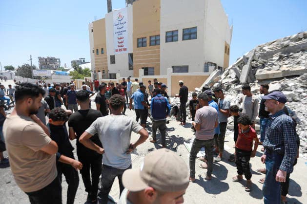 July 13, 2026, Gaza City, Gaza Strip, Palestinian Territory: Palestinians gather at the scene after a motorcycle was struck in western Gaza City. According to medical sources, at least one person was killed in the incident. Emergency teams transferred the victim to a nearby medical facility as authorities assessed the aftermath of the strike. Gaza City Palestinian Territory  - ZUMAz119 20260713_zip_z119_001 Copyright: xSalahxHashemx