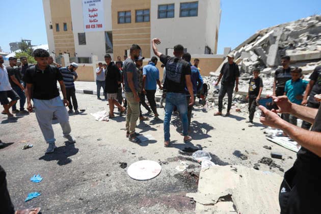 July 13, 2026, Gaza City, Gaza Strip, Palestinian Territory: Palestinians gather at the scene after a motorcycle was struck in western Gaza City. According to medical sources, at least one person was killed in the incident. Emergency teams transferred the victim to a nearby medical facility as authorities assessed the aftermath of the strike. Gaza City Palestinian Territory  - ZUMAz119 20260713_zip_z119_002 Copyright: xSalahxHashemx