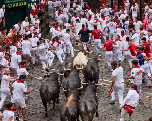 July 13, 2026, Pamplona, Navarre, Spain: People take part in the traditional encierro (bull-run) of the San Fermin Festival in Pamplona, Spain. The bull-running fiesta is held annually from 06 to 14 July in commemoration of the city s patron saint. Visitors from all over the world attend the festival. Many of them physically participate in the highlight event - the running of the bulls, or encierro - where they attempt to outrun the animals along a route through the narrow streets of Pamplona s old city. Pamplona Spain  - ZUMAa206 20260713_zsp_a206_019 Copyright: xRubenxAlbarranx
