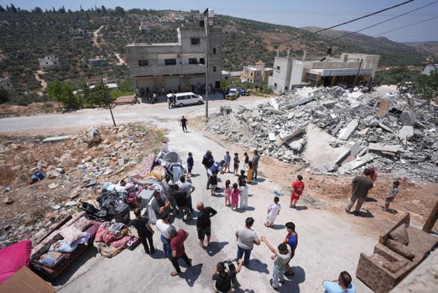 Israel demolishes Palestinian home in the West Bank SALFIT, WEST BANK, PALESTINE - JULY 13: Palestinians are seen as Israeli forces demolish the home of Palestinian Hasan al-Rinawi with a bulldozer and heavy machinery alleging it was built without a permit in the village of Kufr al Dik, west of Salfit in the West Bank, Palestine, on July 13, 2026. Issam Rimawi Anadolu Salfit West Bank. Editorial use only. Please get in touch for any other usage.  Copyright: x2026xAnadoluxIssamxRimawix