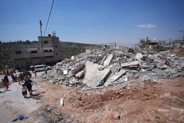 Israel demolishes Palestinian home in the West Bank SALFIT, WEST BANK, PALESTINE - JULY 13: Israeli forces demolish the home of Palestinian Hasan al-Rinawi with a bulldozer and heavy machinery alleging it was built without a permit in the village of Kufr al Dik, west of Salfit in the West Bank, Palestine, on July 13, 2026. Issam Rimawi Anadolu Salfit West Bank. Editorial use only. Please get in touch for any other usage.  Copyright: x2026xAnadoluxIssamxRimawix