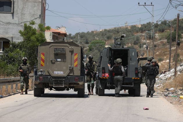 Israel demolishes Palestinian home in the West Bank SALFIT, WEST BANK, PALESTINE - JULY 13: Israeli soldiers take security measures in the area as Israeli forces demolish the home of Palestinian Hasan al-Rinawi with a bulldozer and heavy machinery alleging it was built without a permit in the village of Kufr al Dik, west of Salfit in the West Bank, Palestine, on July 13, 2026. Issam Rimawi Anadolu Salfit West Bank. Editorial use only. Please get in touch for any other usage.  Copyright: x2026xAnadoluxIssamxRimawix