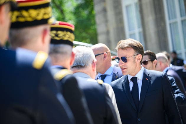 Speech by The President of The Republic to The Armies - Paris Emmanuel Macron, president of the French Republic, greets military personnel after delivering a speech to the armed forces at the Hotel de Brienne in Paris, France on July 13, 2026, wearing sunglasses. Photo by Eric Tschaen Pool ABACAPRESS.COM Paris IDF France  Copyright: xTschaenxEric Pool ABACAx