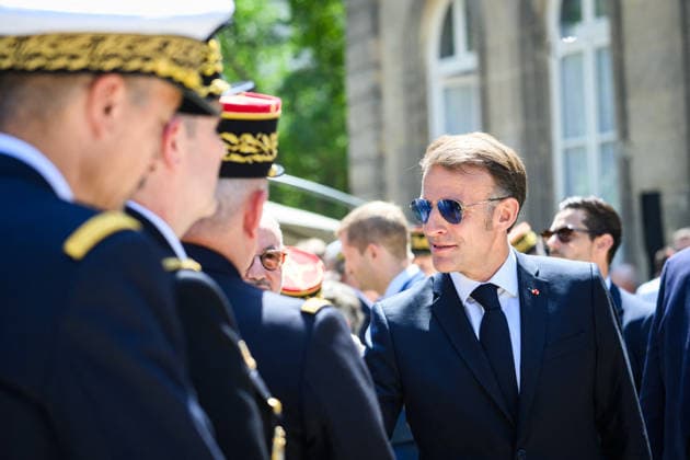 Speech by The President of The Republic to The Armies - Paris Emmanuel Macron, president of the French Republic, greets military personnel after delivering a speech to the armed forces at the Hotel de Brienne in Paris, France on July 13, 2026, wearing sunglasses. Photo by Eric Tschaen Pool ABACAPRESS.COM Paris IDF France  Copyright: xTschaenxEric Pool ABACAx