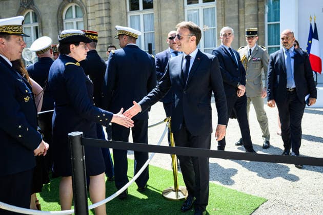 Speech by The President of The Republic to The Armies - Paris Emmanuel Macron, president of the French Republic, greets military personnel after delivering a speech to the armed forces at the Hotel de Brienne in Paris, France on July 13, 2026. Photo by Eric Tschaen Pool ABACAPRESS.COM Paris IDF France  Copyright: xTschaenxEric Pool ABACAx