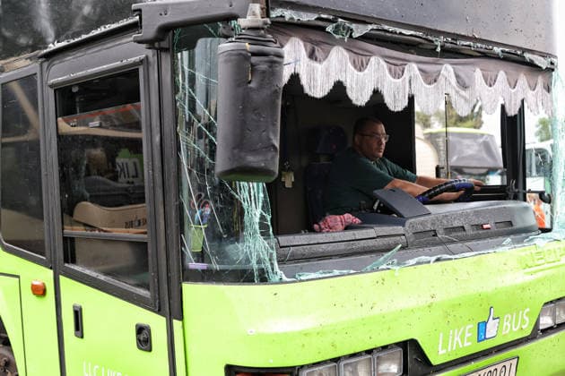RECORD DATE NOT STATED A man sits behind the wheel of a bus damaged in a Russian missile and drone attack at a bus depot in Odesa, Ukraine, on July 13, 2026. Russian forces launched a missile and drone attack on the city on the morning of July 13, damaging a transport company, private houses and a sanatorium building. Four people, including a five-year-old girl, were injured (Photo by Nina Liashonok Ukrinform) Russian attack damages bus depot in Odesa  Copyright: xNinaxLiashonokx