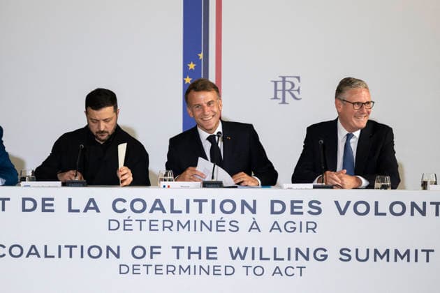The Coalition Of The Willing Summit - Paris (L-R) Ukrainian President Volodymyr Zelenskyy, French President Emmanuel Macron and British Prime Minister Sir Keir Starmer are seen around a table at the Hotel des Invalides ahead of the Coalition of the Willing Summit in Paris, France, on July 13, 2026. Photo by Eliot Blondet ABACAPRESS.COM Paris France  Copyright: xBlondetxEliot ABACAx