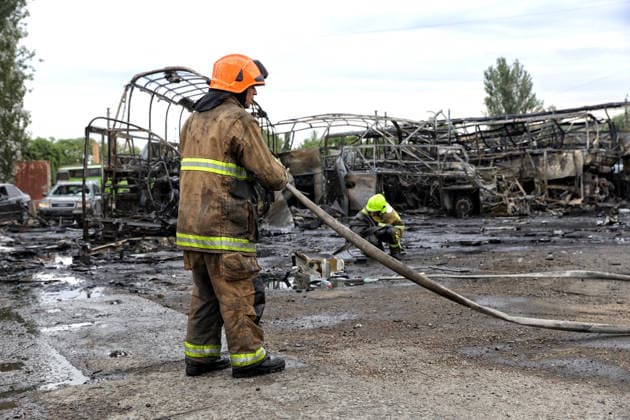 RECORD DATE NOT STATED Russian Attack Damages Bus Depot - Ukraine Firefighters with the State Emergency Service of Ukraine extinguish smoldering hotspots at a bus depot destroyed in a Russian missile and drone attack in Odesa, Ukraine, on July 13, 2026. Russian forces launched a missile and drone attack on the city on the morning of July 13, damaging a transport company, private houses and a sanatorium building. Four people, including a five-year-old girl, were injured (Photo by Nina Liashonok Ukrinform ABACAPRESS.COM) Odesa Ukraine  Copyright: xLyashonokxNina Ukrinform ABACAx