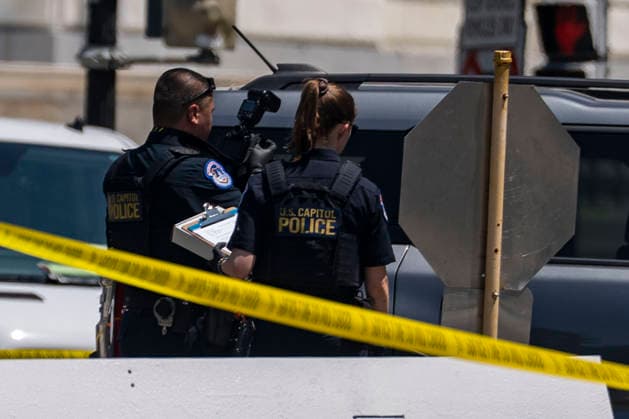 U.S. Capitol Police search a vehicle after draining the driver outside the north barricade entrance to the U.S. Capitol in Washington, DC on Monday, July 13, 2026.  WAP20260713365 BONNIExCASH