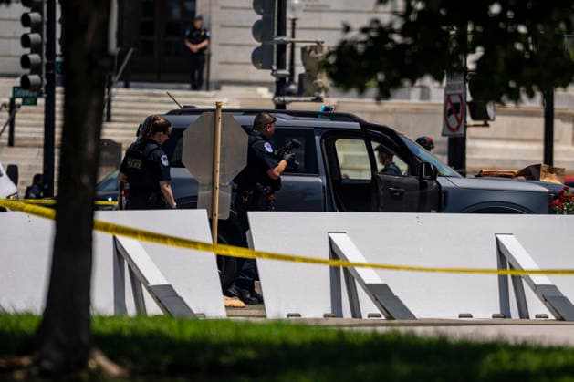 U.S. Capitol Police search a vehicle after draining the driver outside the north barricade entrance to the U.S. Capitol in Washington, DC on Monday, July 13, 2026.  WAP20260713366 BONNIExCASH