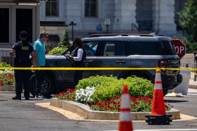 U.S. Capitol Police search a vehicle after draining the driver outside the north barricade entrance to the U.S. Capitol in Washington, DC on Monday, July 13, 2026.  WAP20260713370 BONNIExCASH