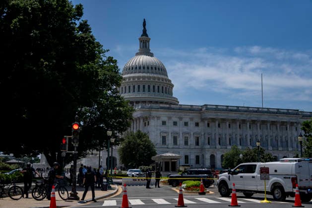 U.S. Capitol Police search a vehicle after draining the driver outside the north barricade entrance to the U.S. Capitol in Washington, DC on Monday, July 13, 2026.  WAP20260713371 BONNIExCASH