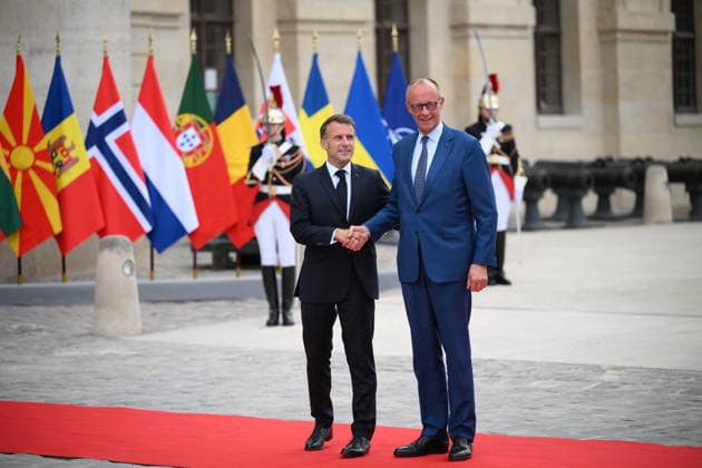 Emmanuel Macron, President of the French Republic, welcomes European leaders to the Coalition of the Willing Summit at the Hôtel des Invalides on July 13, 2026. Eliot Blondet Pool Abaca French President Emmanuel Macron welcomes German Chancellor Friedrich Merz ahead of the Coalition of the Willing Summit in Paris, France on July 13, 2026. Photo by Eliot Blondet, ABACAPRESS.COM, Paris, France  Copyright: xEliotxBlondetx xPoolx xBestimagexEliotxBlondetx xPoolx xBestimagex