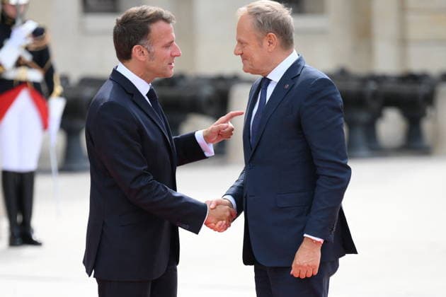 Emmanuel Macron, President of the French Republic, welcomes European leaders to the Coalition of the Willing Summit at the Hôtel des Invalides on July 13, 2026. Eliot Blondet Pool Abaca French President Emmanuel Macron welcomes Polish Prime Minister Donald Franciszek Tusk ahead of the Coalition of the Willing Summit in Paris, France on July 13, 2026. Photo by Eliot Blondet, ABACAPRESS.COM, Paris, France  Copyright: xEliotxBlondetx xPoolx xBestimagexEliotxBlondetx xPoolx xBestimagex