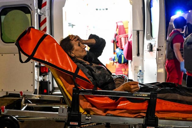 RECORD DATE NOT STATED A woman injured in a nighttime Russian drone attack lies on a wheeled medical stretcher during emergency response efforts in Zaporizhzhia, Ukraine, on July 12, 2026. Six people, including a 15-year-old boy, were injured in the attack (Photo by Dmytro Smolienko Ukrinform) Nighttime Russian drone strike hits Zaporizhzhia  Copyright: xDmytroxSmolienkox