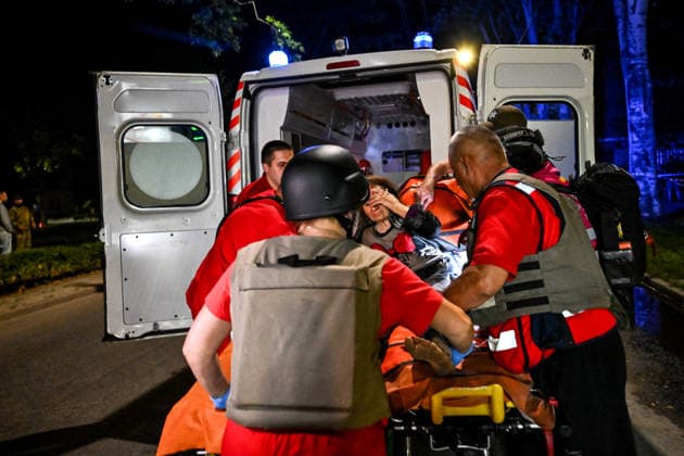 RECORD DATE NOT STATED Paramedics load a woman on a wheeled medical stretcher into an ambulance during emergency response efforts following a nighttime Russian drone attack in Zaporizhzhia, Ukraine, on July 12, 2026. Six people, including a 15-year-old boy, were injured in the attack (Photo by Dmytro Smolienko Ukrinform) Nighttime Russian drone strike hits Zaporizhzhia  Copyright: xDmytroxSmolienkox