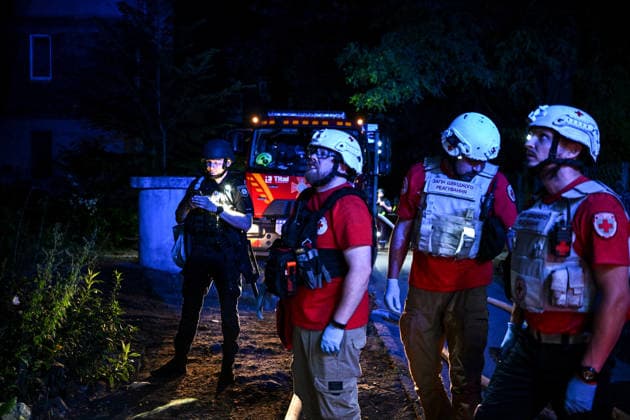 RECORD DATE NOT STATED An officer of the National Police of Ukraine and members of a rapid response medical team work at the scene of a nighttime Russian drone attack in Zaporizhzhia, Ukraine, on July 12, 2026. Six people, including a 15-year-old boy, were injured in the attack (Photo by Dmytro Smolienko Ukrinform) Nighttime Russian drone strike hits Zaporizhzhia  Copyright: xDmytroxSmolienkox