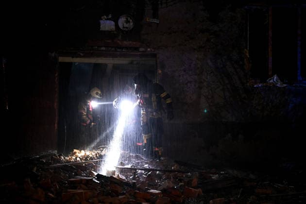 RECORD DATE NOT STATED Rescue workers carrying flashlights inspect a building flooded during firefighting efforts after it was damaged in a nighttime Russian drone attack in Zaporizhzhia, Ukraine, on July 12, 2026. Six people, including a 15-year-old boy, were injured in the attack(Photo by Dmytro Smolienko Ukrinform) Nighttime Russian drone strike hits Zaporizhzhia  Copyright: xDmytroxSmolienkox