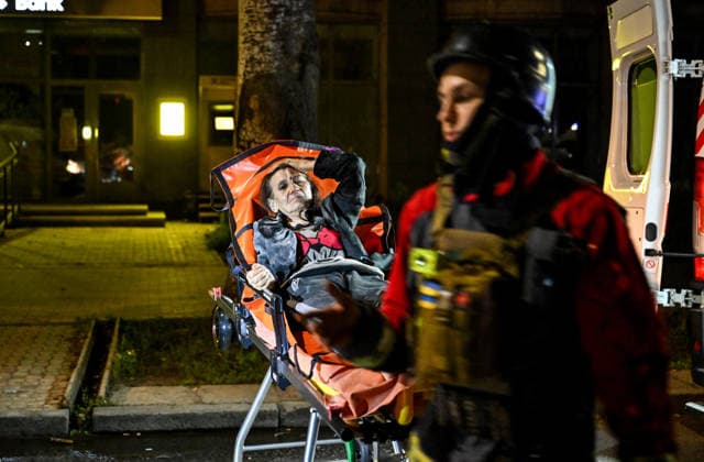 RECORD DATE NOT STATED A woman injured in a nighttime Russian drone attack lies on a wheeled medical stretcher during emergency response efforts in Zaporizhzhia, Ukraine, on July 12, 2026. Six people, including a 15-year-old boy, were injured in the attack (Photo by Dmytro Smolienko Ukrinform) Nighttime Russian drone strike hits Zaporizhzhia  Copyright: xDmytroxSmolienkox