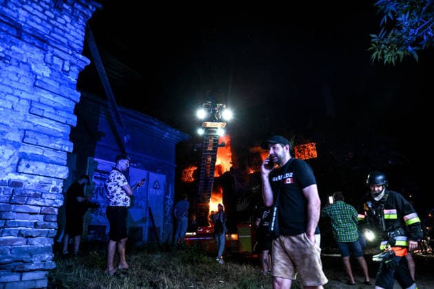 RECORD DATE NOT STATED A man talks on the phone at the site of a nighttime Russian drone strike in Zaporizhzhia, Ukraine, on July 12, 2026. Six people, including a 15-year-old boy, were injured in the attack(Photo by Dmytro Smolienko Ukrinform) Nighttime Russian drone strike hits Zaporizhzhia  Copyright: xDmytroxSmolienkox