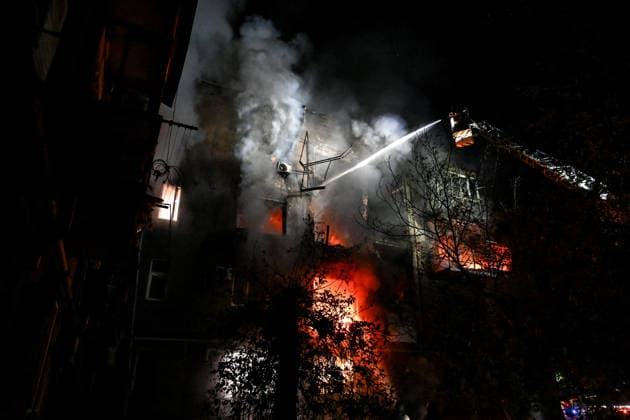 RECORD DATE NOT STATED A firefighter with the State Emergency Service of Ukraine extinguishes a fire from an aerial ladder at a residential building set ablaze by a nighttime Russian drone attack in Zaporizhzhia, Ukraine, on July 12, 2026. Six people, including a 15-year-old boy, were injured in the attack (Photo by Dmytro Smolienko Ukrinform) Nighttime Russian drone strike hits Zaporizhzhia  Copyright: xDmytroxSmolienkox