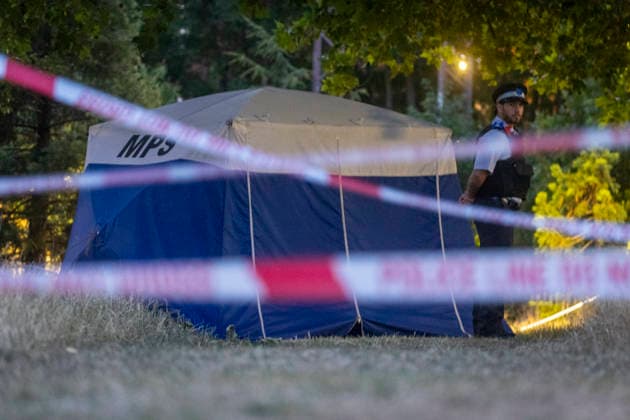 July 13, 2026, London, London, UK: London, UK. Emergency services at the scene in Hackney Downs, east London, following the fatal stabbing of a man in his late 20s. Police were called at around 1. 45pm to reports of a stabbing in a park near a school. Despite the efforts of paramedics, the victim died at the scene. London UK  - ZUMAl94_ 20260713_zaf_l94_019 Copyright: xMarcinxNowakx