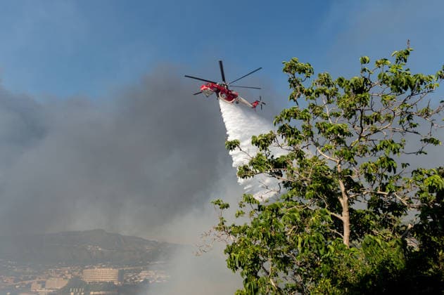 Wildfire erupts near Campi Flegrei volcanic area in Italy POZZUOLI, ITALY - JULY 13: An helicopter drops water over a wildfire in the Pisciarelli area located on the outer edge of the Solfatara volcanic crater in the Campi Flegrei (Phlegraean Fields) volcanic region in Pozzuoli on July 13, 2026. The fire broke out in the undergrowth and quickly spread to several car dealerships, causing fuel tanks and tyres to explode. Eliano Imperato Anadolu Pozzuoli Italy. Editorial use only. Please get in touch for any other usage.  Copyright: x2026xAnadoluxElianoxImperatox