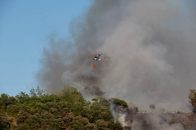 Wildfire erupts near Campi Flegrei volcanic area in Italy POZZUOLI, ITALY - JULY 13: An helicopter flights over a wildfire in the Solfatara volcanic crater in the Campi Flegrei (Phlegraean Fields) volcanic region in Pozzuoli on July 13, 2026. The fire broke out in the undergrowth and quickly spread in the Pisciarelli area to several car dealerships, causing fuel tanks and tyres to explode. Eliano Imperato Anadolu Pozzuoli Italy. Editorial use only. Please get in touch for any other usage.  Copyright: x2026xAnadoluxElianoxImperatox