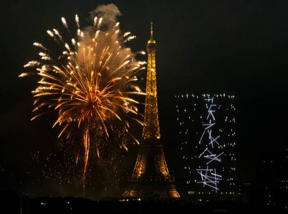 (260713) -- PARIS, July 13, 2026 -- Fireworks illuminate the sky near the Eiffel Tower during the Bastille Day celebrations in Paris, France, on July 13, 2026. ) FRANCE-PARIS-BASTILLE DAY-FIREWORKS-DRONE PERFORMANCE WuxHuiwo 