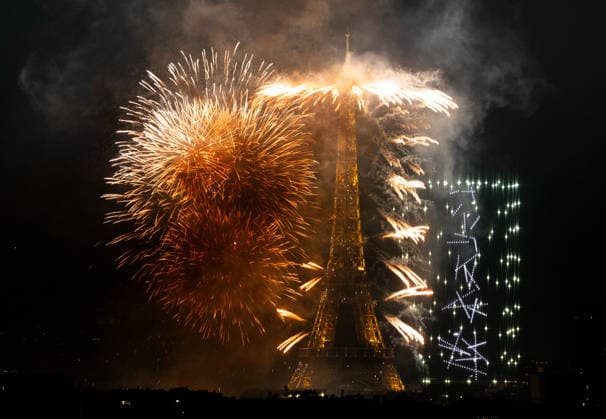 (260713) -- PARIS, July 13, 2026 -- Fireworks illuminate the sky near the Eiffel Tower during the Bastille Day celebrations in Paris, France, on July 13, 2026. ) FRANCE-PARIS-BASTILLE DAY-FIREWORKS-DRONE PERFORMANCE WuxHuiwo 