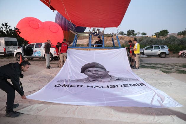 Cappadocia commemorates martyrs of 2016 defeated coup attempt NEVSEHIR, TURKIYE - JULY 14: Hot air balloons take off in Cappadocia carrying Turkish flags and banners featuring photographs of the 253 martyrs to commemorate July 15 Democracy and National Unity Day in Nevsehir, Turkiye on July 14, 2026. As part of the event organized by the Nevsehir Governorship, banners displaying Turkish flags and photographs of the martyrs were attached to the hot air balloons. Behcet Alkan Anadolu Nevsehir Turkey. Editorial use only. Please get in touch for any other usage.  Copyright: x2026xAnadoluxBehcetxAlkanx