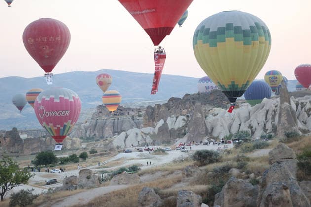 News Themen der Woche KW29 Cappadocia commemorates martyrs of 2016 defeated coup attempt NEVSEHIR, TURKIYE - JULY 14: Hot air balloons take off in Cappadocia carrying Turkish flags and banners featuring photographs of the 253 martyrs to commemorate July 15 Democracy and National Unity Day in Nevsehir, Turkiye on July 14, 2026. As part of the event organized by the Nevsehir Governorship, banners displaying Turkish flags and photographs of the martyrs were attached to the hot air balloons. Behcet Alkan Anadolu Nevsehir Turkey. Editorial use only. Please get in touch for any other usage.  Copyright: x2026xAnadoluxBehcetxAlkanx