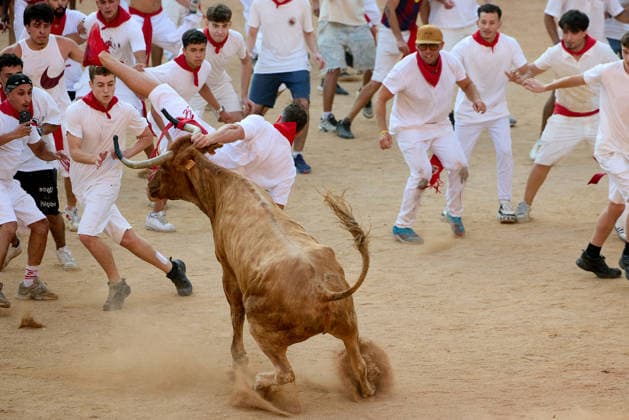 July 14, 2026, Pamplona, Navarre, Spain: People take part in the traditional encierro (bull-run) of the San Fermin Festival in Pamplona, Spain on July 14, 2026. The bull-running fiesta is held annually from 06 to 14 July in commemoration of the city s patron saint. Visitors from all over the world attend the festival. Many of them physically participate in the highlight event - the running of the bulls, or encierro - where they attempt to outrun the animals along a route through the narrow streets of Pamplona s old city. Pamplona Spain - ZUMAa206 20260714_zsp_a206_005 Copyright: xRubenxAlbarranx