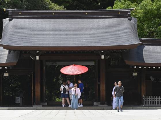 Extreme heat grips Tokyo as temperatures rise across eastern Japan TOKYO, JAPAN - JULY 14 : A staff member carries a red parasol at the Meiji Jingu shrine during hot weather in Tokyo, Japan, July 14, 2026. Temperatures in central Tokyo were forecast to reach 34 degrees Celsius as intense heat spread across eastern Japan. David Mareuil Anadolu Tokyo Japan. Editorial use only. Please get in touch for any other usage.  Copyright: x2026xAnadoluxDavidxMareuilx