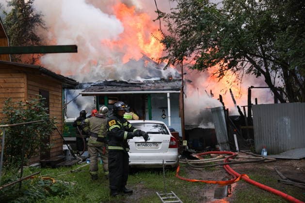 RUSSIA, MYTISHCHI - JULY 14, 2026: Firefighters put out a fire at a residential house. Georgy Chernyshov TASS  95024271