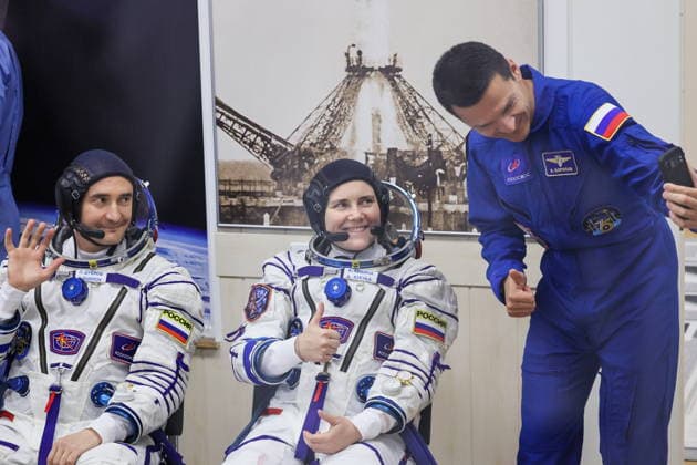 KAZAKHSTAN, BAIKONUR - JULY 14, 2026: Roscosmos cosmonaut Konstantin Borisov (standing) and ISS Expedition 74 75 prime crew members, NASA astronaut Anil Menon and Roscosmos cosmonaut Anna Kikina (L-R seated) are seen during a spacesuit check before the launch of the Soyuz-2.1a rocket booster carrying the Soyuz MS-29 spacecraft from Baikonur Cosmodrome. Sergei Savostyanov TASS  95029128