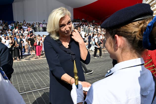 July 14, 2026, military parade in Nice attended by Marine Le Pen, who was invited by Eric Ciotti, the mayor of Nice, president of the UDR, and an ally of the RN, on the sidelines of the commemorations marking the tenth anniversary of the Nice attack. Marine Le Pen arrived accompanied by the UDR representative for the Alpes-Maritimes, Christelle D’Intorni, to applause from the official stands. During the parade, the declared candidate for the upcoming presidential election sat in the front row, flanked by Bernard Chaix and Christelle D’Intorni, the UDR members of the National Assembly from the Alpes-Maritimes, Alexandra Louis, the interministerial delegate for victim assistance (DIAV), the prefect of the Alpes-Maritimes, Laurent Houttiaux,  Copyright: xBrunoxBebertx xBestimagexBrunoxBebertx xBestimagex