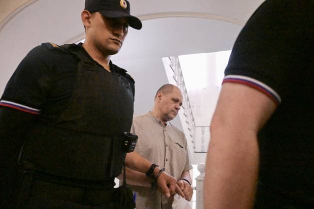 Russia Artpodgotovka Movement Trial 9205207 14.07.2026 A defendant in the case against members of the Artpodgotovka extremist organisation, which is banned in Russia, accused of plotting to blow up a train in Russia s Orenburg region, is escorted before a hearing at the Second Western District Military Court in Moscow, Russia. Evgeny Biyatov Sputnik Moscow Russia  Copyright: xEvgenyxBiyatovx