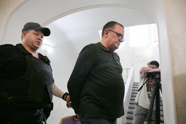Russia Artpodgotovka Movement Trial 9205206 14.07.2026 A defendant in the case against members of the Artpodgotovka extremist organisation, which is banned in Russia, accused of plotting to blow up a train in Russia s Orenburg region, is escorted before a hearing at the Second Western District Military Court in Moscow, Russia. Evgeny Biyatov Sputnik Moscow Russia  Copyright: xEvgenyxBiyatovx