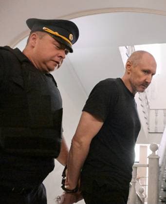 Russia Artpodgotovka Movement Trial 9205209 14.07.2026 A defendant in the case against members of the Artpodgotovka extremist organisation, which is banned in Russia, accused of plotting to blow up a train in Russia s Orenburg region, is escorted by police before a hearing at the Second Western District Military Court in Moscow, Russia. Evgeny Biyatov Sputnik Moscow Russia  Copyright: xEvgenyxBiyatovx